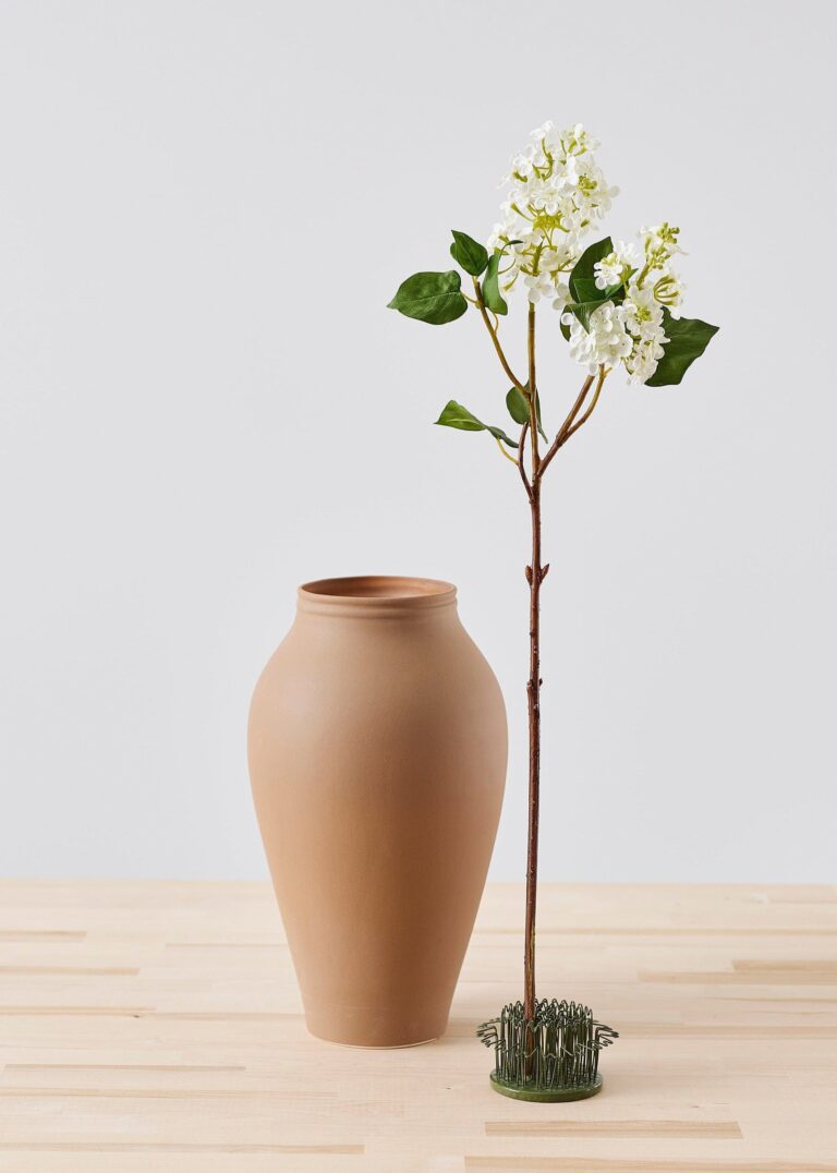 Close-up of vase silhouette detail on this Round Flower Hairpin Flower Frog - 3.5 inch