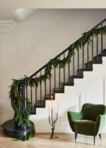 Close-up of greenery along the garland on this Real Touch Norfolk Pine Norfolk Pine