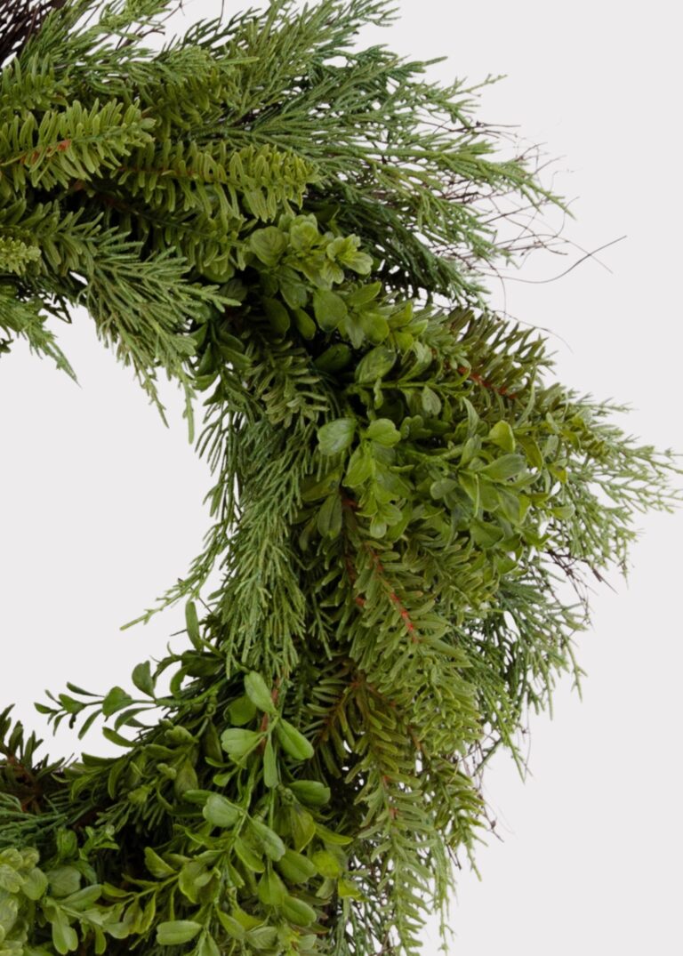Close-up of blooms and berries on this Real Touch Boxwood and Pine Winter Greenery Wreath
