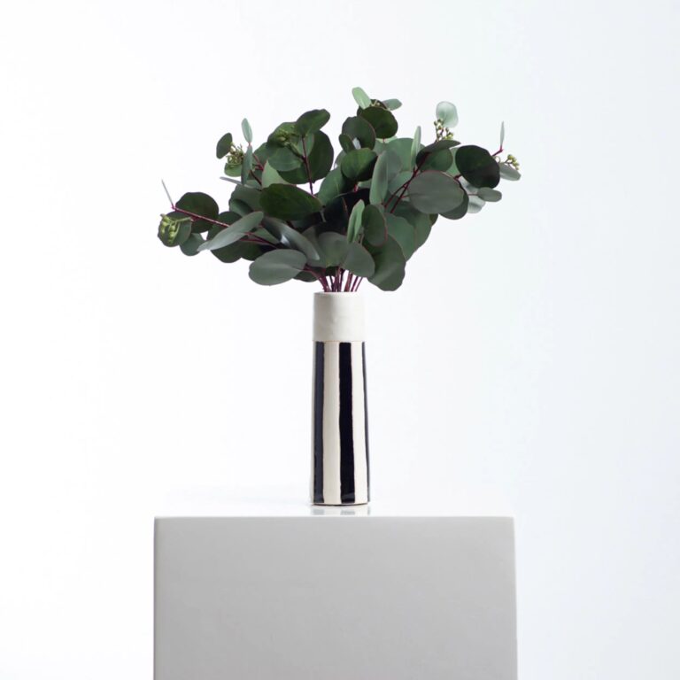 Close-up of vase silhouette detail on this Real Touch Seeded Silver Dollar Ceramic Tori Vase