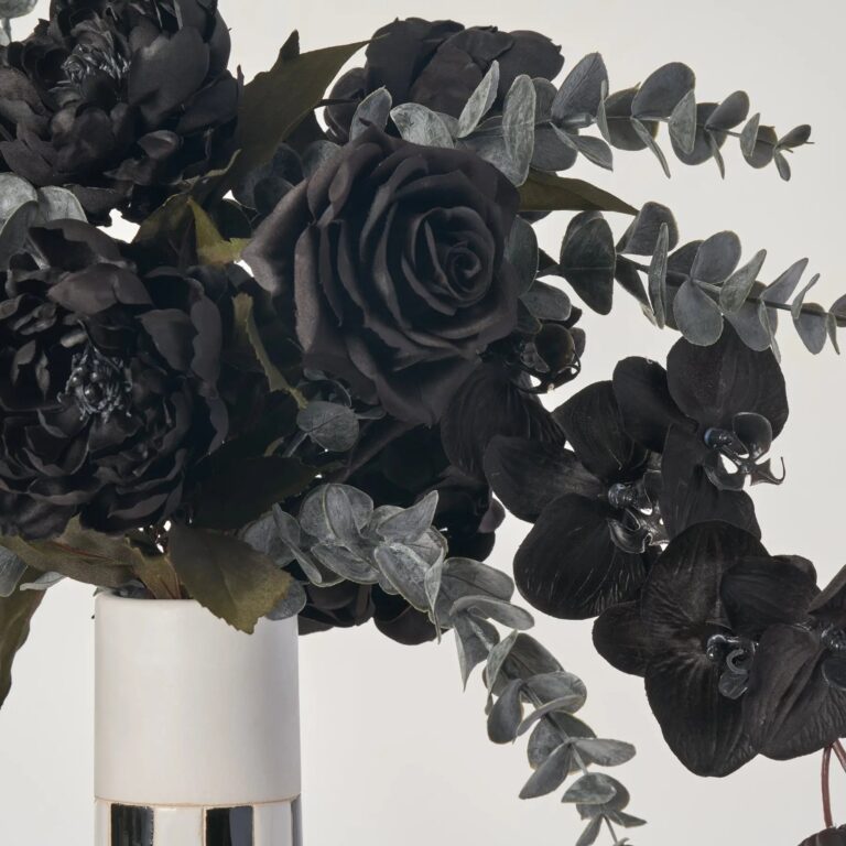 Close-up of vase silhouette detail on this Black Beetle - Orchid, Peony Halloween Floral Arrangement