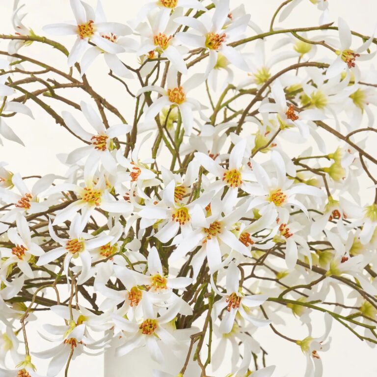 Close-up of vase silhouette detail on this White Gypsophila Branch Arrangement White Tall Vase