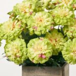 Side view of the Faux Marigold Blooms Arrangement Small Planter Box revealing frond and leaf