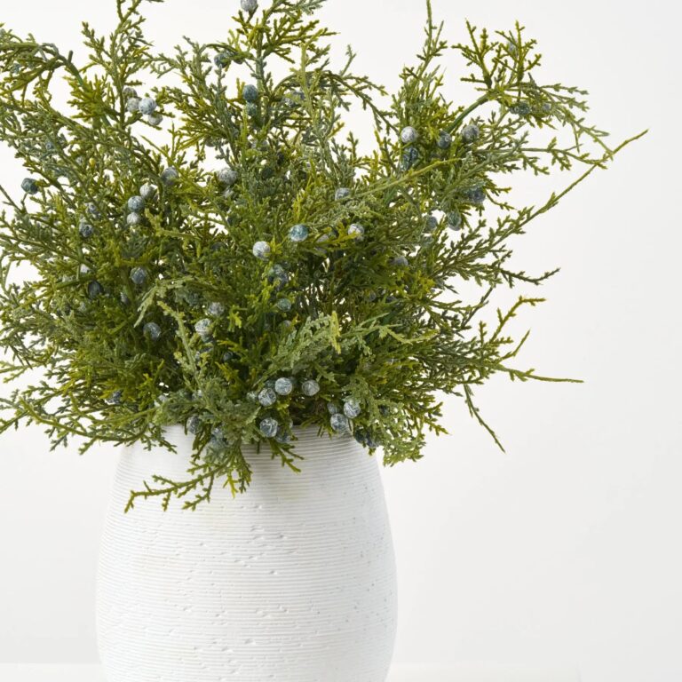 Close-up of leaf foliage texture on this Lifelike Juniper Berry Small Faux Winter Holiday Arrangement