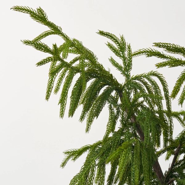 Close-up of leaf foliage texture on this Real Touch Norfolk Topiary Tree Christmas Centerpiece Arrangement