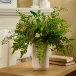 Alternate angle of the Mixed Fern and Wildflower Seeding Greenery Centerpiece Arrangement showing bloom arrangement