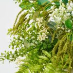 Close-up of vase silhouette detail on this Mixed Fern and Wildflower Seeding Greenery Centerpiece Arrangement