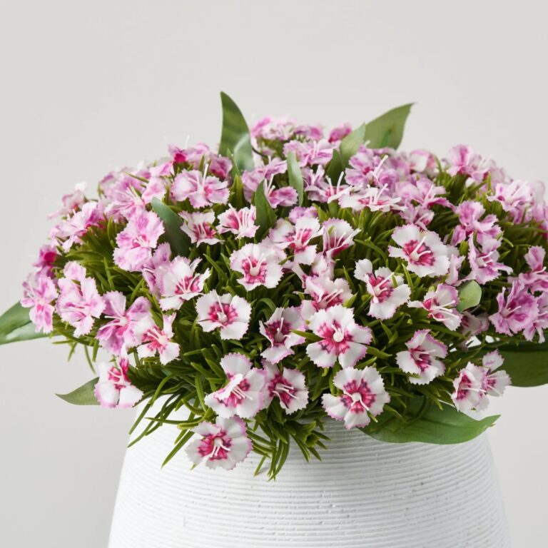 Close-up of bloom cluster detail on this Mixed Real Touch Purple Spring Floral Arrangement Centerpiece