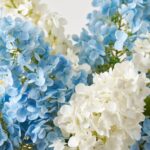 Close-up of vase silhouette detail on this Hampton's Breeze - Real Touch Large Centerpiece Arrangement