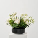 Alternate angle of the Jungle Elegance - Large White Black Glass Vase showing bloom arrangement