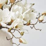 Close-up of vase silhouette detail on this Classic White Magnolia Blooms Everyday Centerpiece Arrangement