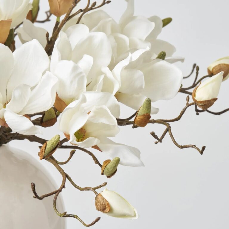 Close-up of vase silhouette detail on this Classic White Magnolia Blooms Everyday Centerpiece Arrangement