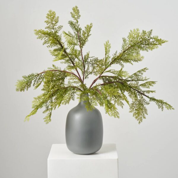 Close-up of vase silhouette detail on this Lifelike Large Cedar Branches Greenery Winter Centerpiece Arrangement