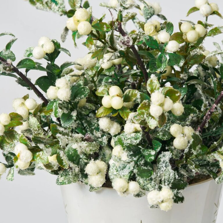Close-up of vase silhouette detail on this Glitter Cream Snowberry and Boxwood Holiday Table Arrangement