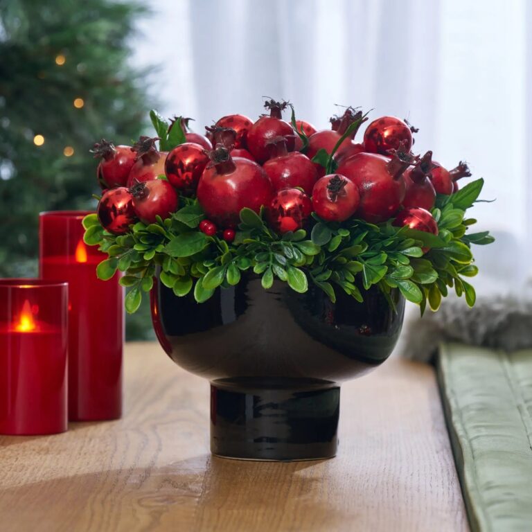 Close-up of bloom cluster detail on this Christmas Crown of Pomegranates Bowl Centerpiece Arrangement