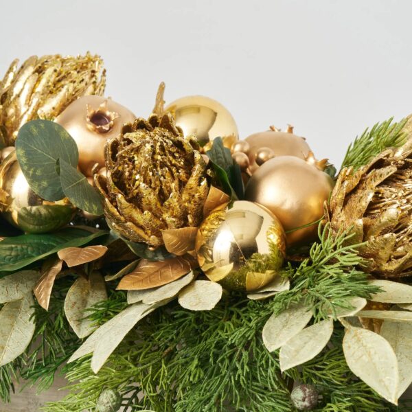 Close-up of bloom cluster detail on this All That Glitters - Gold Cedar Christmas Arrangement