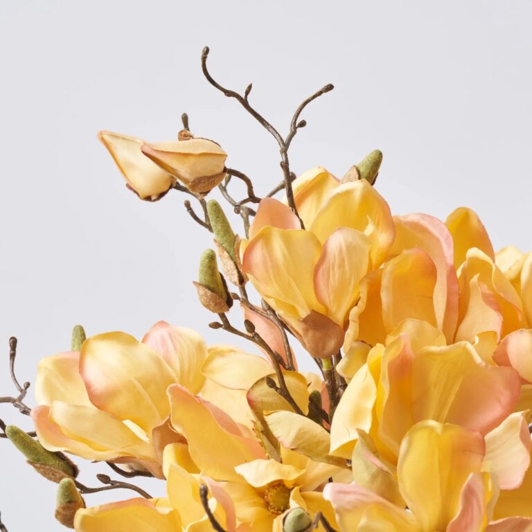 Close-up of vase silhouette detail on this Golden Yellow Magnolia Blooms Everyday Centerpiece Arrangement