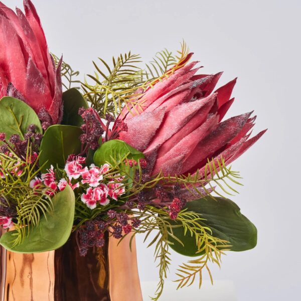 Close-up of bloom cluster detail on this Enchanted Hearts - Burgundy King Pot Spring Arrangement