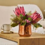Alternate angle of the Enchanted Hearts - Burgundy King Pot Spring Arrangement showing full arrangement