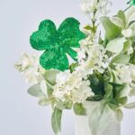 Close-up of vase silhouette detail on this Lucky Lilacs - White Blooms, Patrick's Day Arrangement