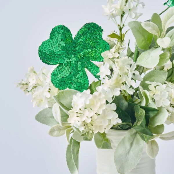Close-up of vase silhouette detail on this Lucky Lilacs - White Blooms, Patrick's Day Arrangement