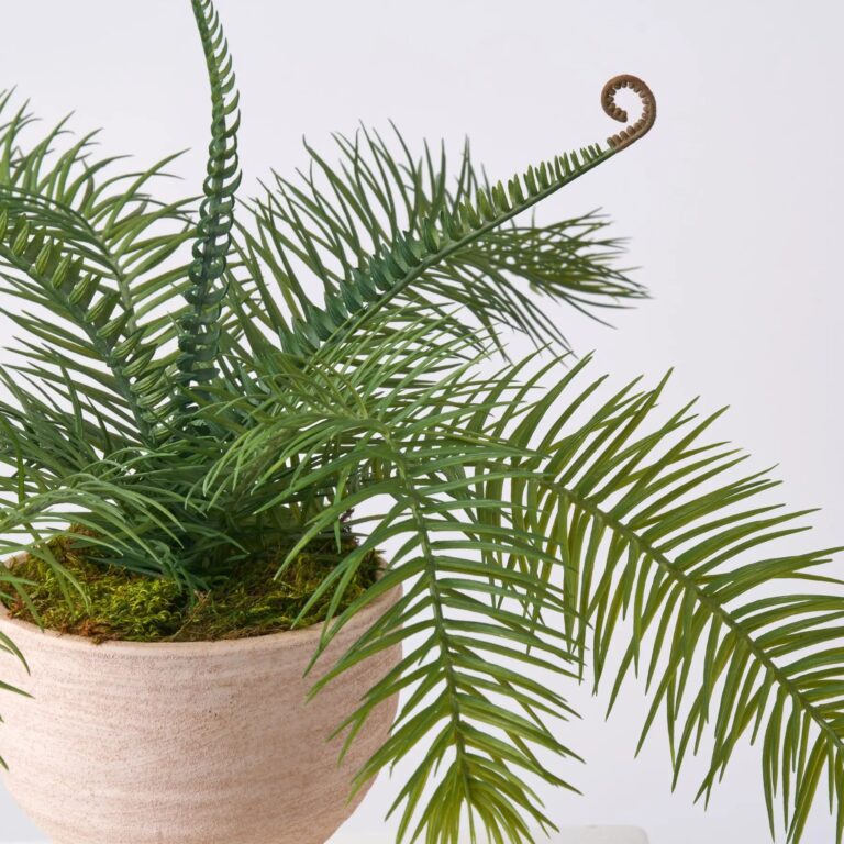 Close-up of vase silhouette detail on this Wild Faux Cycas Fern Greenery Spring Arrangement