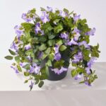 Detail view of planter detail from the Blooming Purple Petunia Cascade Faux Urn Filler Arrangement