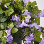 The Blooming Purple Petunia Cascade Faux Urn Filler Arrangement shown in full, highlighting branch layering