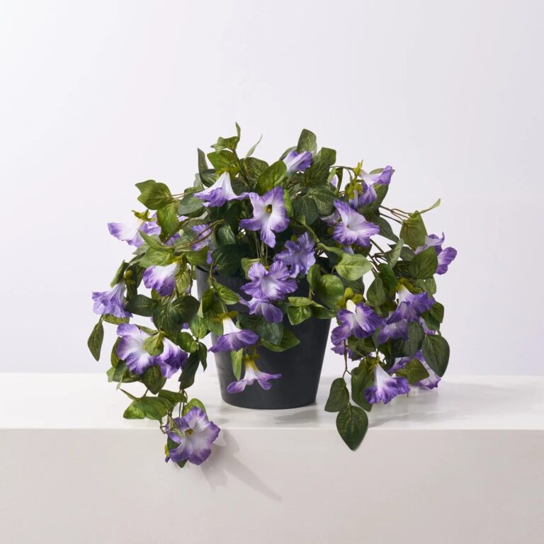 Close-up of leaf foliage texture on this Blooming Purple Petunia Cascade Faux Urn Filler Arrangement