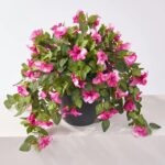 Detail view of planter detail from the Blooming Magenta Petunia Cascade Faux Urn Filler Arrangement