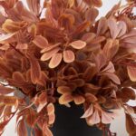 Detail view of stem and foliage layering from the Autumn Terracotta Privet Bush Faux Front