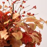 Close-up of bloom cluster detail on this Fall Medley - Oak Leaf Urn Filler Arrangement
