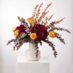Alternate angle of the Fall Sangria - Real Touch Taper Neck Vase showing bloom arrangement