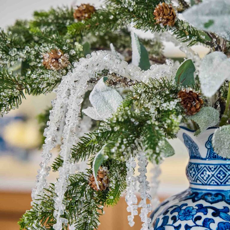 Close-up of vase silhouette detail on this Iced Crystal Cascades - Snow Large Centerpiece Arrangement