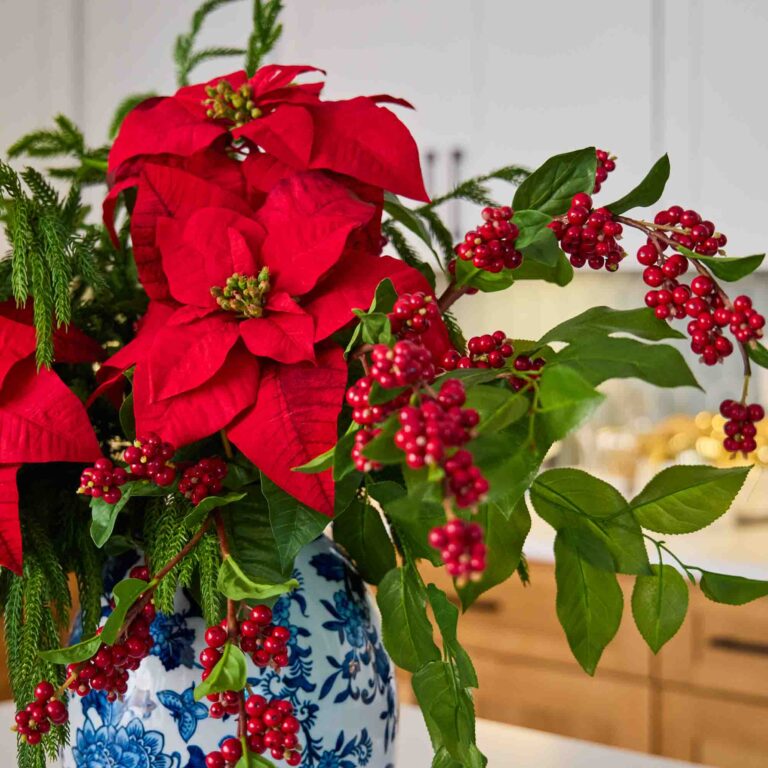 Close-up of bloom cluster detail on this Holiday Majesty - Real Touch Christmas Centerpiece Arrangement