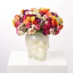 Close-up of bloom cluster detail on this Rainbow Ranunculus Sugar Skull Faux Muertos Centerpiece Arrangement