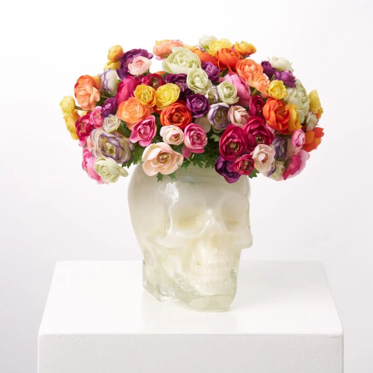 Close-up of bloom cluster detail on this Rainbow Ranunculus Sugar Skull Faux Muertos Centerpiece Arrangement