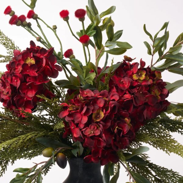 Close-up of bloom cluster detail on this Tuscan Christmas - Deep Red Floral Centerpiece Arrangement