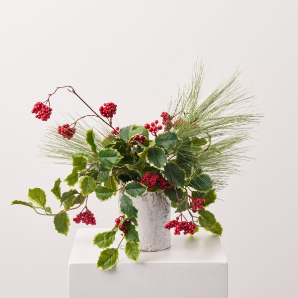 Close-up of leaf foliage texture on this Variegated Holly Leaf, Winter Berry Christmas Holiday Arrangement