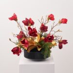 Close-up of vase silhouette detail on this Gilded Christmas Magnolia - Golden Vase Holiday Arrangement