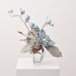 Alternate angle of the Icy Blue Winter Blast Vase Christmas Arrangement showing bloom arrangement in