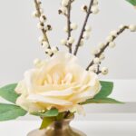 Close-up of vase silhouette detail on this Cream Winter Tea Rose Antique Gold Urn Budvase