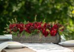 Side view of the Burgundy Red Hydrangea, Wild Cranberry Christmas Floral Arrangement revealing full arrangement