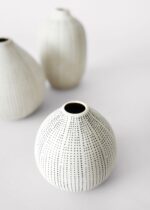 Alternate angle of the Set of 3 Dotted Stoneware Stoneware Bud Vases showing bloom arrangement