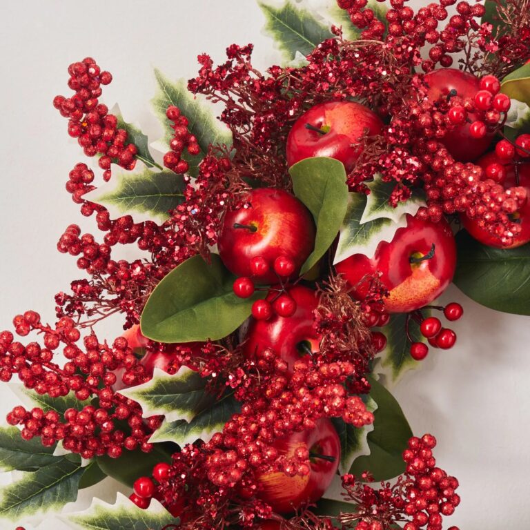 Close-up of blooms and berries on this Holly Jolly Apple - Red Door Christmas Wreath