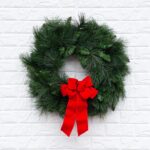 Alternate angle of the Outdoor UV Protected Long Needle Red Velvet Bow showing wreath face