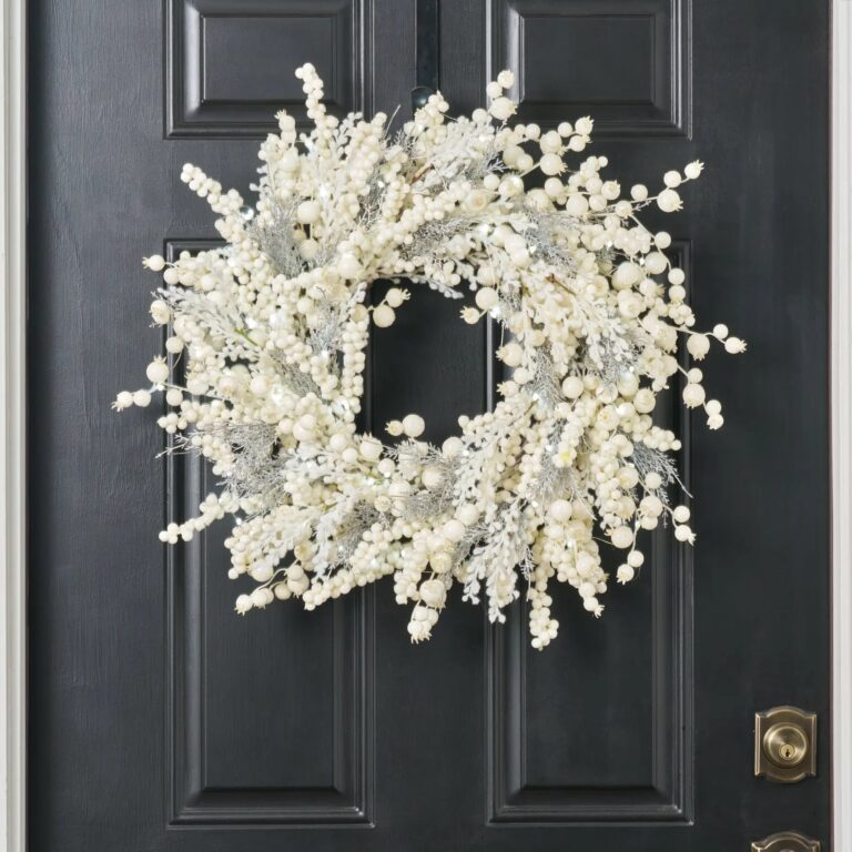 Close-up of blooms and berries on this Winter Wonderland - Cream Glitter Holiday Christmas Wreath