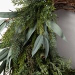 Alternate angle of the Winter's Bounty - Mixed Juniper, Front Door Wreath showing wreath face