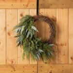 Detail view of layered greenery detail from the Winter's Bounty - Mixed Juniper, Front Door