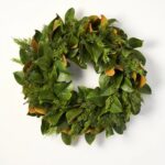 Close-up of blooms and berries on this Real Touch Magnolia Leaf Front Door Wreath